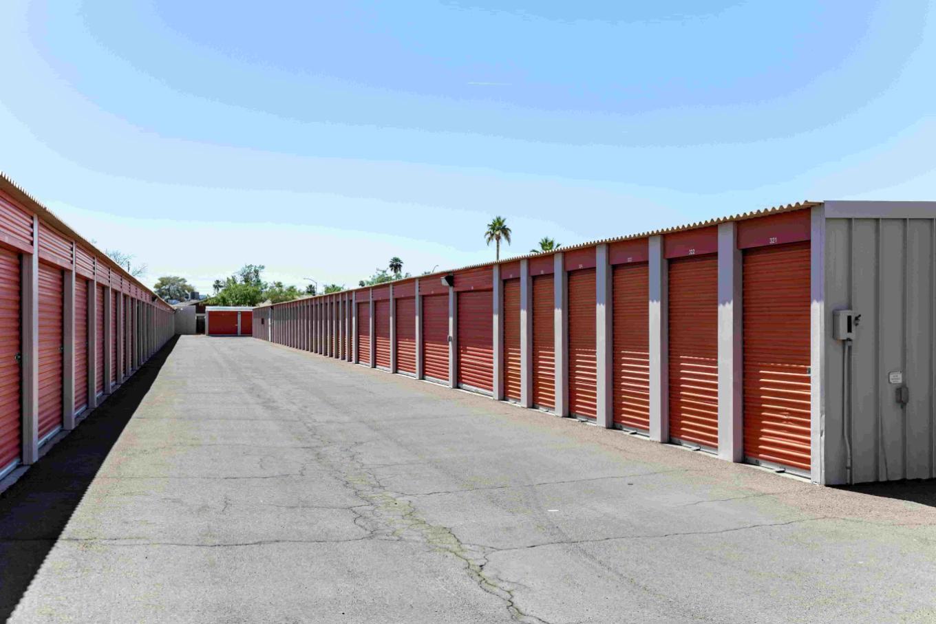 Rows of outdoor storage units with red doors