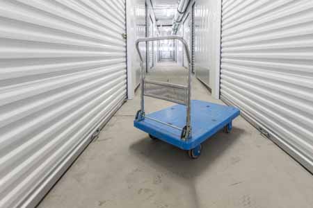 Moving cart inside the hallway of a storage facility.