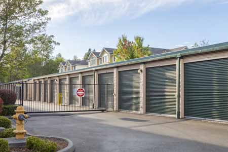 Drive up storage units with a security gate.