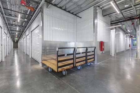 Large indoor storage facility with moving dollies.