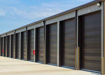 Exterior of large drive up self storage units.