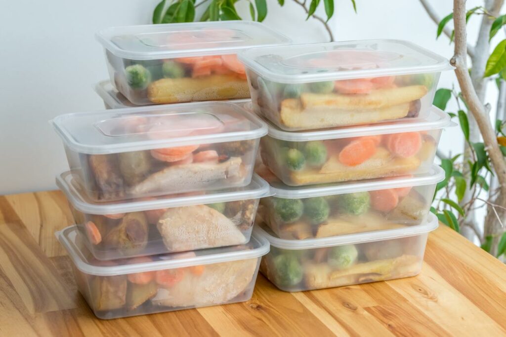 Meals prepared in a set of plastic storage containers.